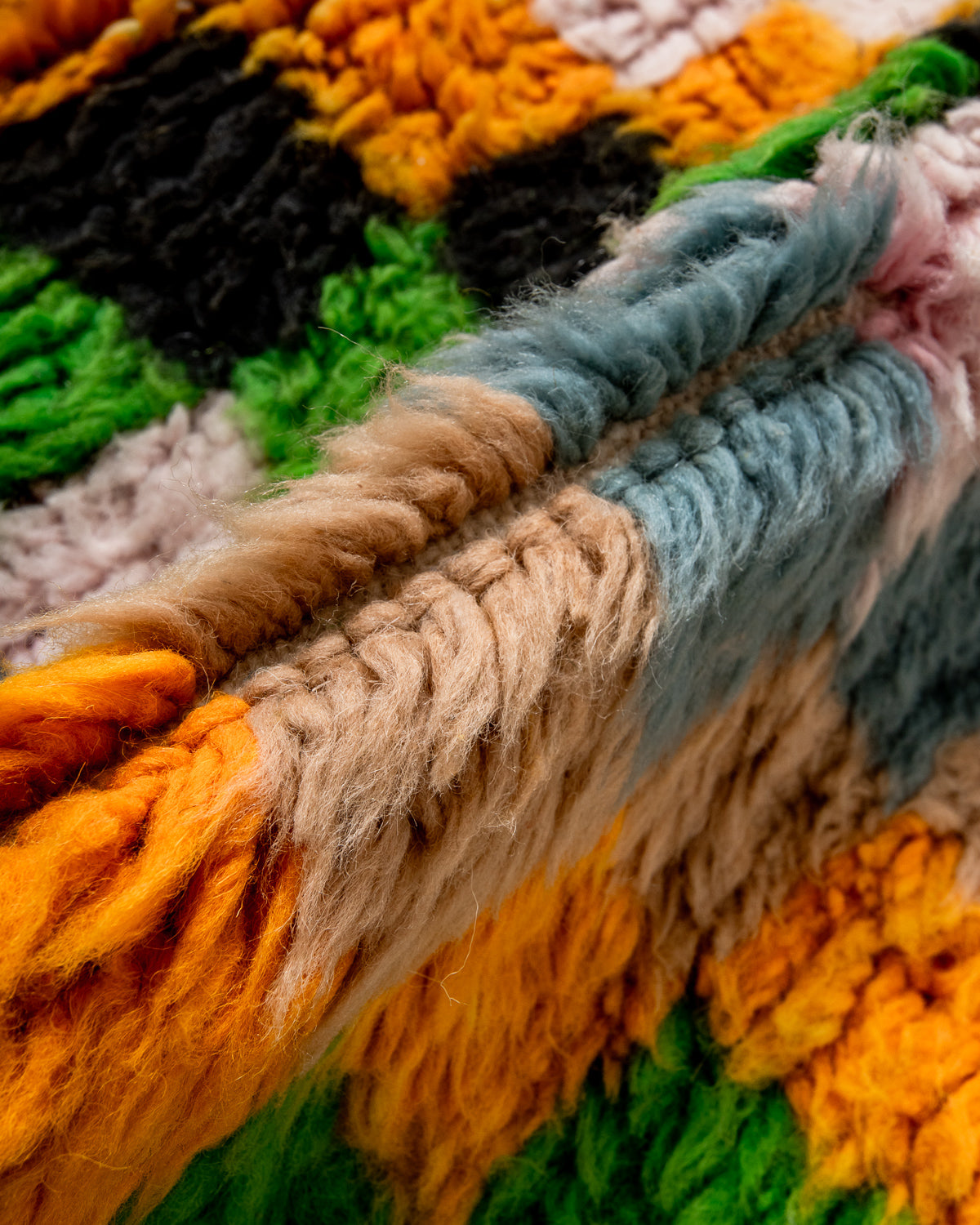 Modern, designer, handcrafted Berber rug from Morocco. Beniourain carpet with beautiful colours and patterns and fluffy wool texture.
